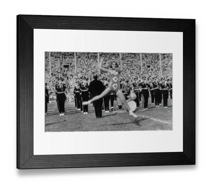 Framed Print : Majorette Mid Jump During Band Performance