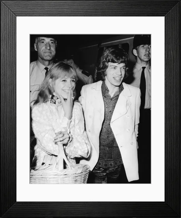 Framed Print : Rock Musician Mick Jagger and Girlfriend Boarding Train Framed Print : Rock Musician Mick Jagger and Girlfriend Boarding Train