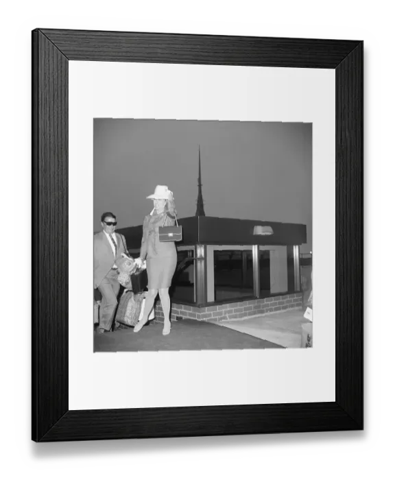 Framed Print : Grace Kelly Holding Her Luggage Framed Print : Grace Kelly Holding Her Luggage
