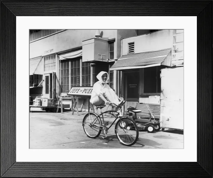 Framed Print : Katharine Hepburn Riding a Bicycle Framed Print : Katharine Hepburn Riding a Bicycle