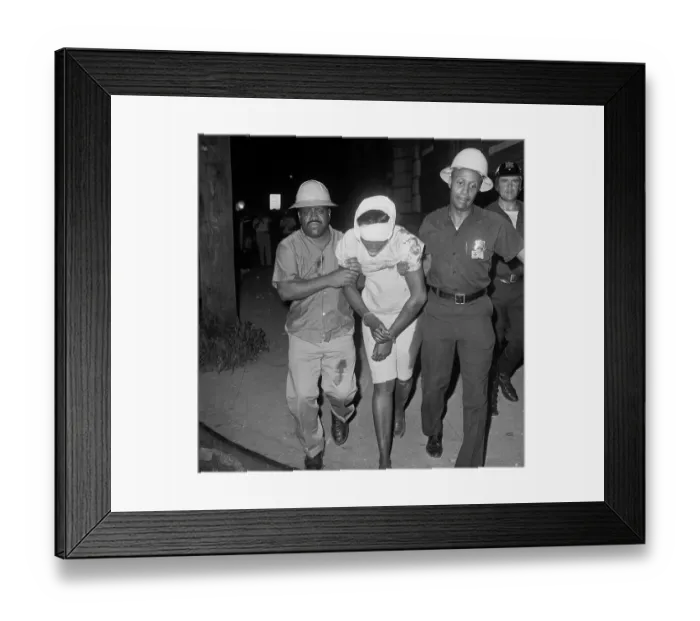 Framed Print : Police Taking Wounded Woman Away Framed Print : Police Taking Wounded Woman Away