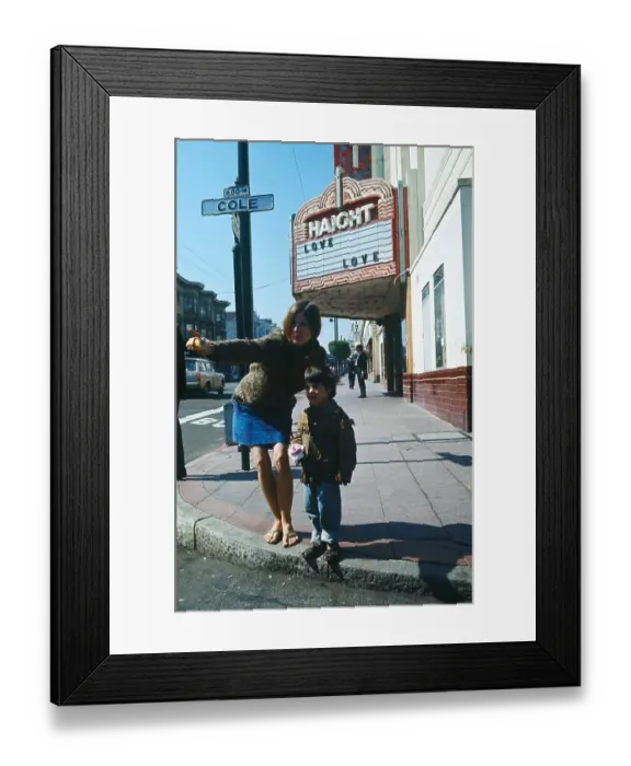 Framed Print : A Hippie and Young Boy Standing on a Street Corner Framed Print : A Hippie and Young Boy Standing on a Street Corner