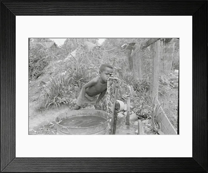 Framed Print : Child Drinking Water from Pipe Framed Print : Child Drinking Water from Pipe