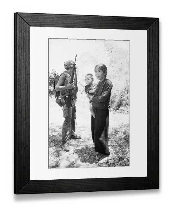 Framed Print : US Marine Standing by Woman and Child Framed Print : US Marine Standing by Woman and Child