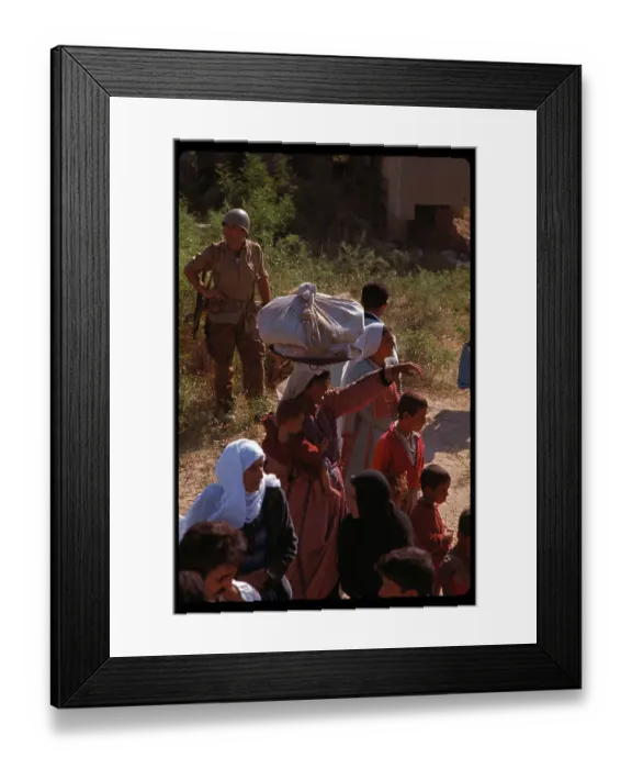 Framed Print : Soldier Watching Over a Group of People Framed Print : Soldier Watching Over a Group of People