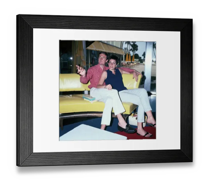 Framed Print : Liza Minelli and Peter Allen Sitting on Yellow Leather Sofa Framed Print : Liza Minelli and Peter Allen Sitting on Yellow Leather Sofa