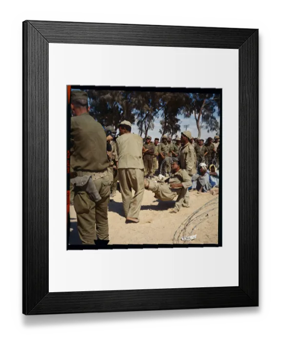 Framed Print : Soldiers Carrying Wounded Man Framed Print : Soldiers Carrying Wounded Man