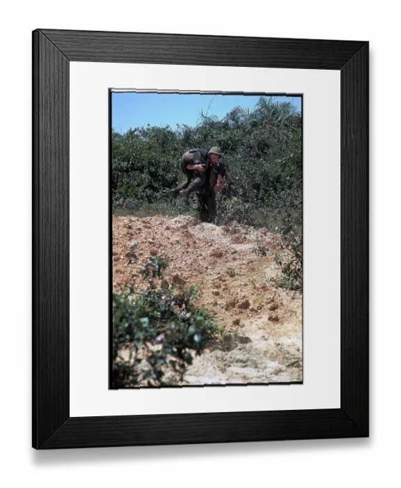 Framed Print : Marine Carrying Soldier to Safety Framed Print : Marine Carrying Soldier to Safety