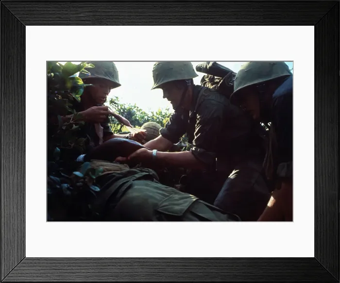 Framed Print : US Marine Aiding Wounded Soldier