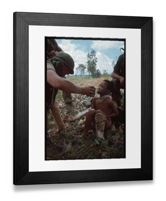 Framed Print : US Marine Helping a Vietnamese Boy Framed Print : US Marine Helping a Vietnamese Boy