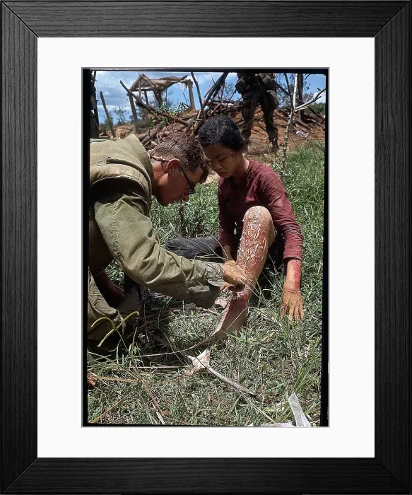 Framed Print : US Marine Treating a Vietnamese Girl Framed Print : US Marine Treating a Vietnamese Girl