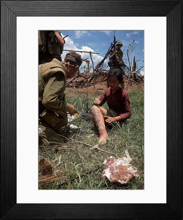 Framed Print : Marine Treats Leg Burns on Vietnam Girl