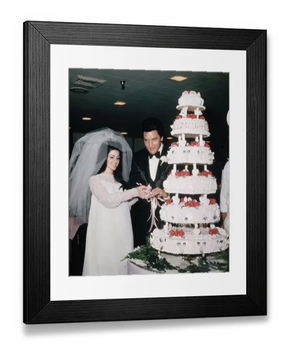 Framed Print : Elvis and Priscilla Presley Cutting Wedding Cake Framed Print : Elvis and Priscilla Presley Cutting Wedding Cake