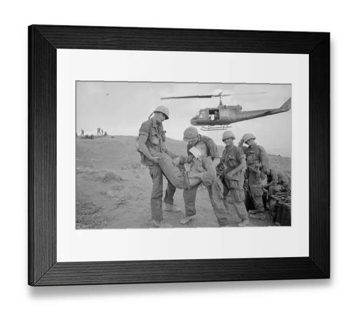 Framed Print : Soldiers Carrying Wounded To Helicopter
