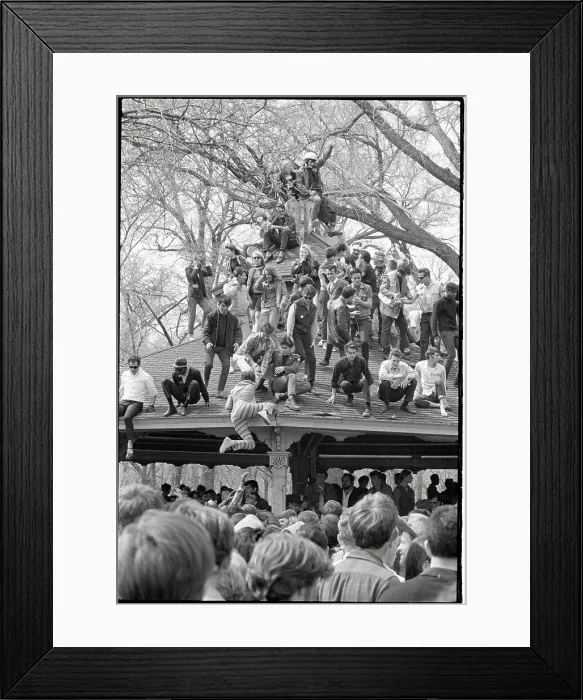Framed Print : Hippies at Love-In Climb on a Roof