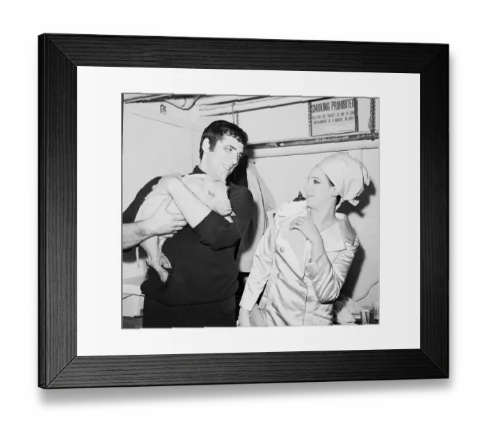 Framed Print : Elliott Gould Giving Wife Barbara Streisand a Pig Framed Print : Elliott Gould Giving Wife Barbara Streisand a Pig