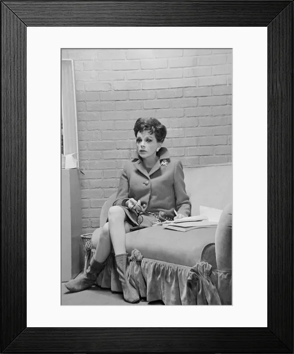 Framed Print : Judy Garland Sitting on Sofa Framed Print : Judy Garland Sitting on Sofa