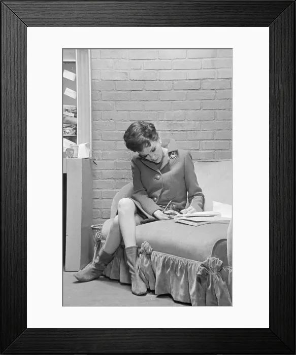 Framed Print : Judy Garland Sitting on Sofa Framed Print : Judy Garland Sitting on Sofa