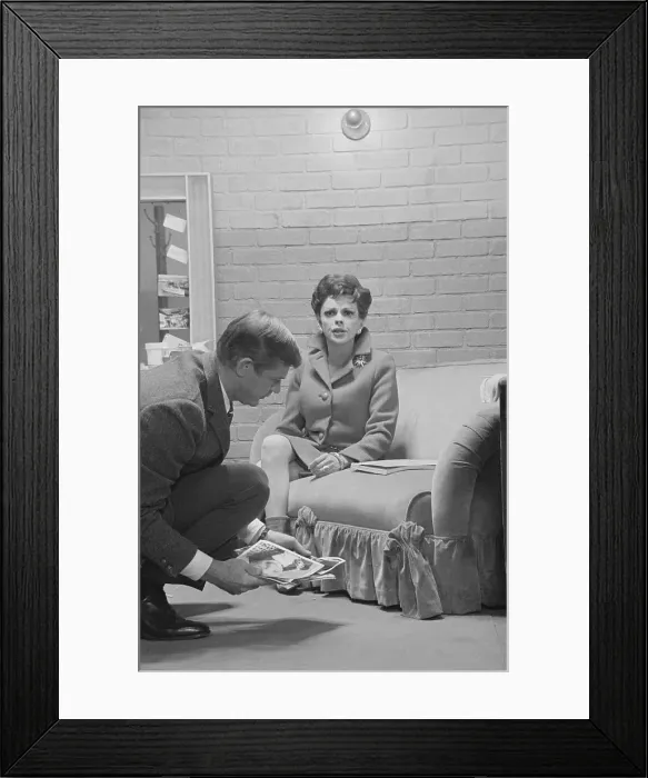 Framed Print : Judy Garland Sitting on Sofa Framed Print : Judy Garland Sitting on Sofa
