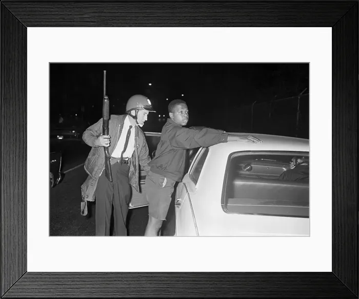Framed Print : Policeman Searching Youth Framed Print : Policeman Searching Youth