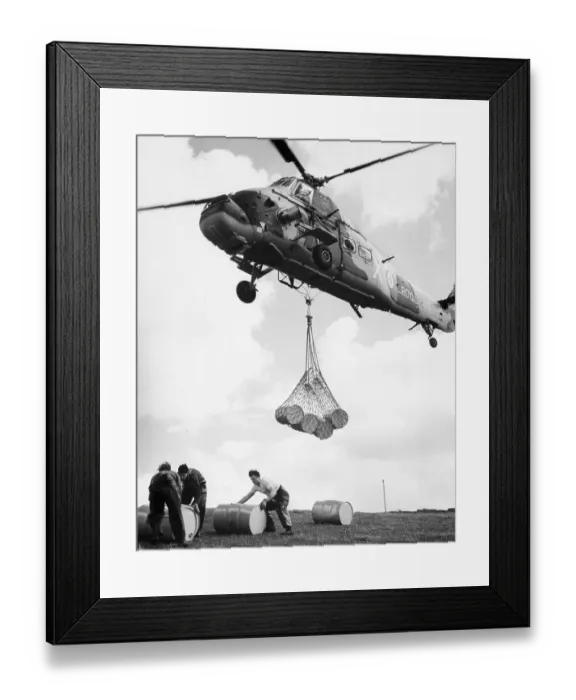 Framed Print : Helicopter Delivering Barrel / Detergent Framed Print : Helicopter Delivering Barrel / Detergent