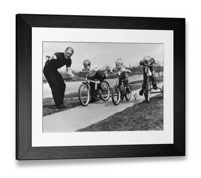 Framed Print : Hockey Player Bobby Hull with His Sons on Bicycles Framed Print : Hockey Player Bobby Hull with His Sons on Bicycles