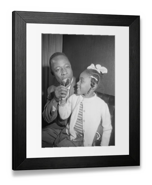 Framed Print : Hank Aaron Licking Lollipop with Young Girl Framed Print : Hank Aaron Licking Lollipop with Young Girl