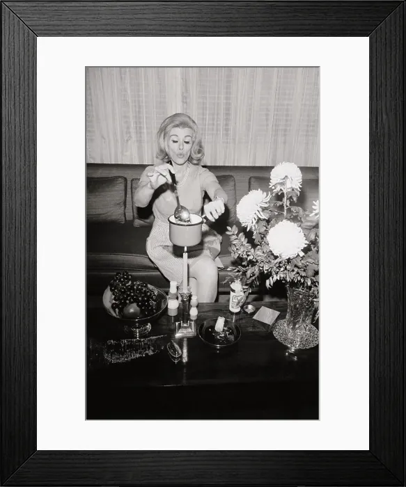 Framed Print : Joan Rivers Cooking over a Candle