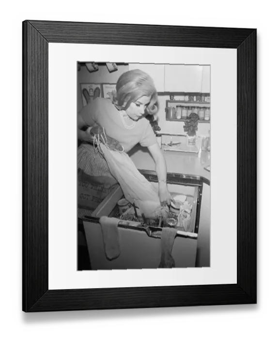 Framed Print : Joan Rivers Pulling Clothes from Dishwasher