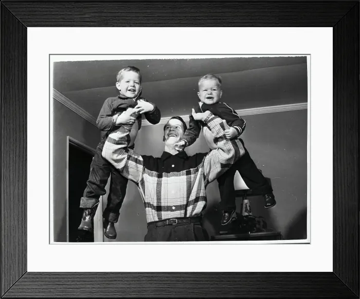 Framed Print : Gordon Howe Holding His Sons in Air Framed Print : Gordon Howe Holding His Sons in Air