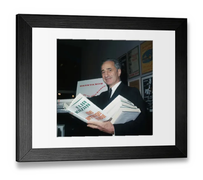 Framed Print : Elia Kazan Holding His New Book Framed Print : Elia Kazan Holding His New Book
