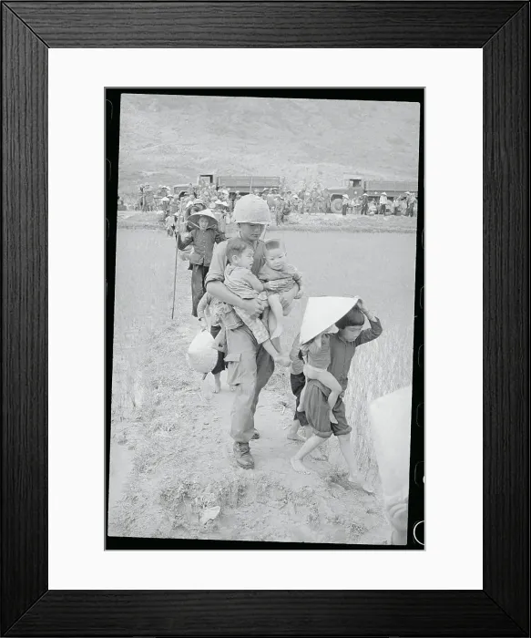 Framed Print : Soldier Aiding Children