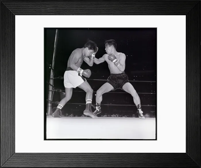 Framed Print : Saldivar Blocks Punch From Japanese Boxer