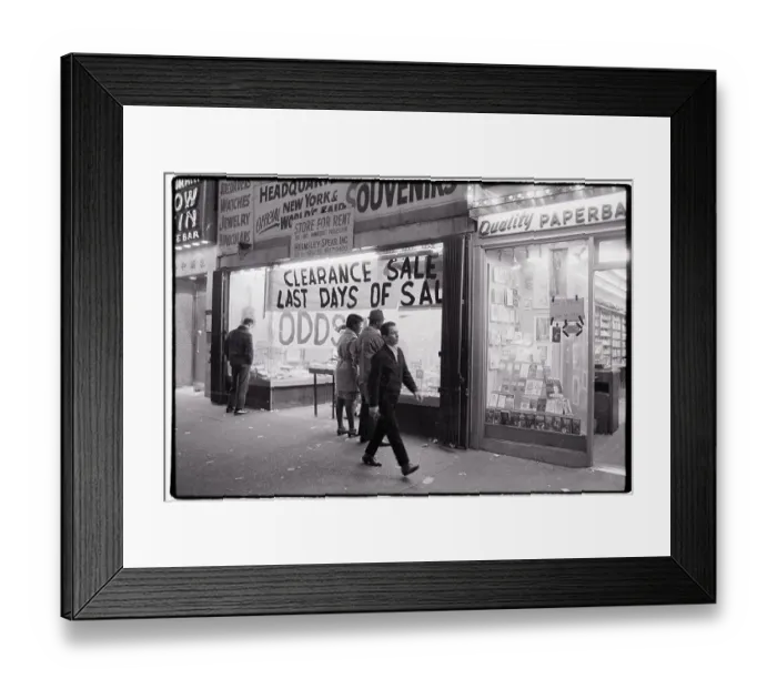 Framed Print : Man Walking Past Clearance Sale at Store Framed Print : Man Walking Past Clearance Sale at Store