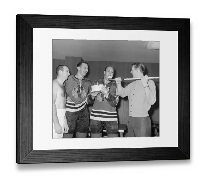 Framed Print : Bobby Hull Eating Cake from Hockey Stick Framed Print : Bobby Hull Eating Cake from Hockey Stick