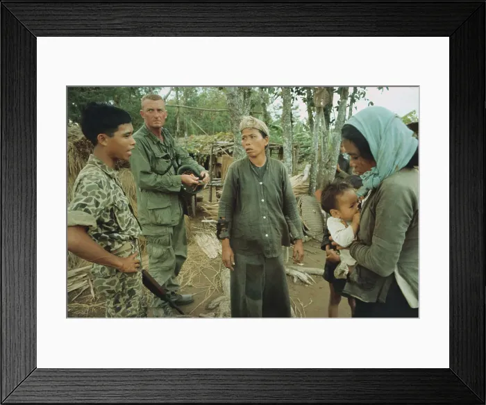 Framed Print : Soldier Questioning a Woman in Viet Cong Village Framed Print : Soldier Questioning a Woman in Viet Cong Village