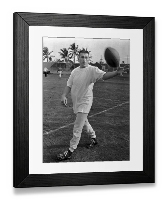 Framed Print : Johnny Unitas Reaching for Ball During Practice