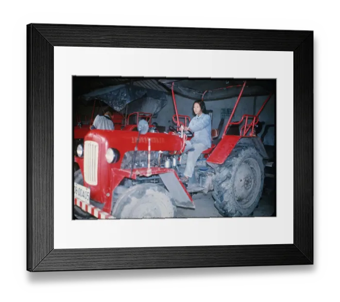 Framed Print : Girl Driving Tractor Framed Print : Girl Driving Tractor
