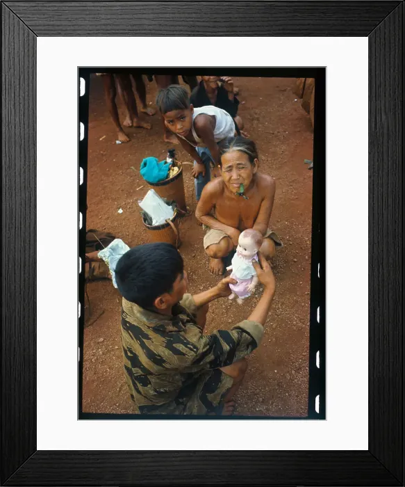 Framed Print : Soldier Giving a Doll to a Youngster Framed Print : Soldier Giving a Doll to a Youngster