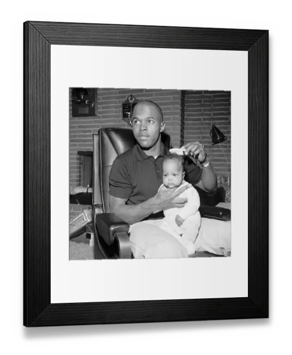 Framed Print : Chicago Bears Gale Sayers Brushes His Daughter's Hair Framed Print : Chicago Bears Gale Sayers Brushes His Daughter's Hair
