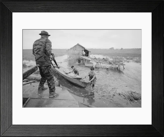 Framed Print : Soldiers Inspecting Huts In Delta Framed Print : Soldiers Inspecting Huts In Delta