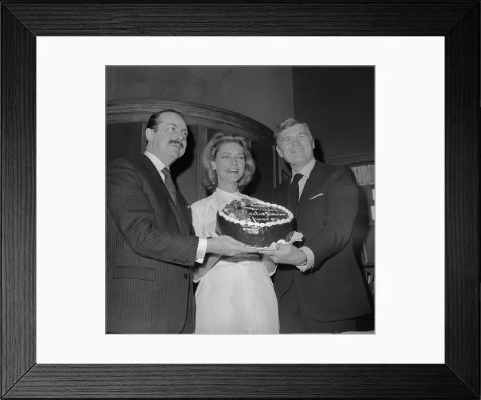 Framed Print : Lauren Bacall Holding a Birthday Cake with Colleagues Framed Print : Lauren Bacall Holding a Birthday Cake with Colleagues
