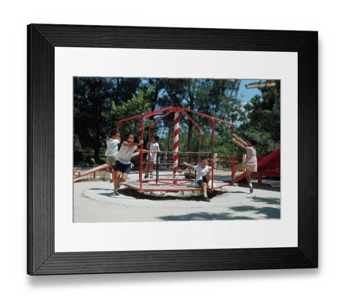Framed Print : Children Playing on Merry-go-round Framed Print : Children Playing on Merry-go-round