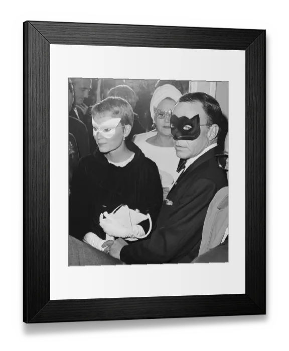 Framed Print : Frank Sinatra and Mia Farrow Wearing Masks Framed Print : Frank Sinatra and Mia Farrow Wearing Masks