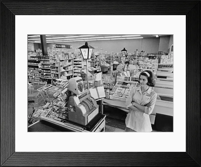 Framed Print : Safeway Cashier Stands at Register Framed Print : Safeway Cashier Stands at Register