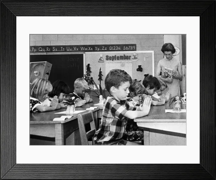 Framed Print : First Graders Pray in Classroom