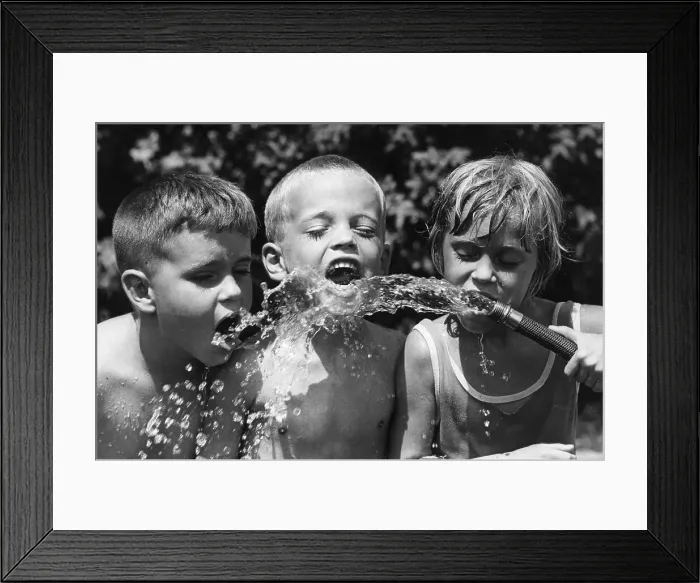 Framed Print : Children Drinking from Garden Hose Framed Print : Children Drinking from Garden Hose