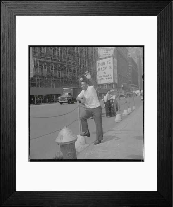 Framed Print : Pele Standing by Macy's Sign on Street Framed Print : Pele Standing by Macy's Sign on Street