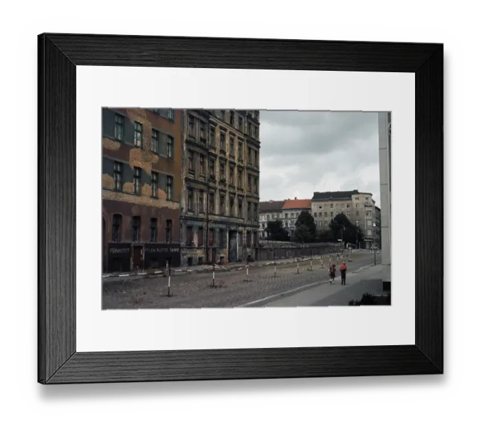 Framed Print : People Strolling Past the Berlin Wall