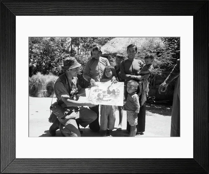 Framed Print : Photographer Kyoichi Sawada Presenting Prize Winning Photo to Villagers